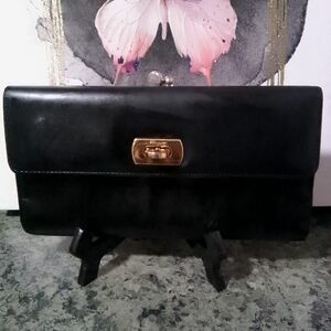 Salvatore Ferragamo Kisslock Black Wallet.